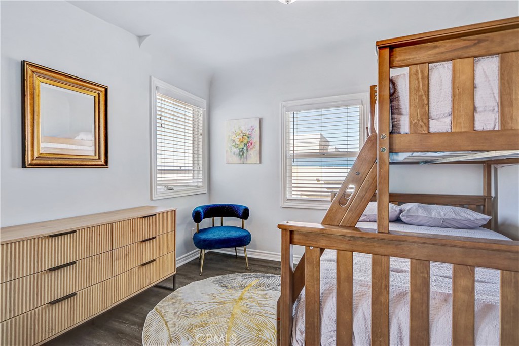 230 40th Street, Unit 1 Manhattan Beach, CA 90266 - Photo 17 of 19 a bedroom with furniture and a window