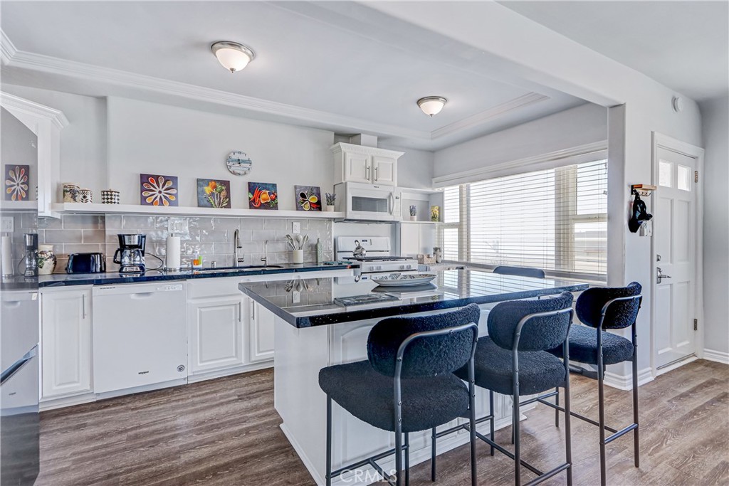 230 40th Street, Unit 1 Manhattan Beach, CA 90266 - Photo 6 of 19 a kitchen with a sink and cabinets
