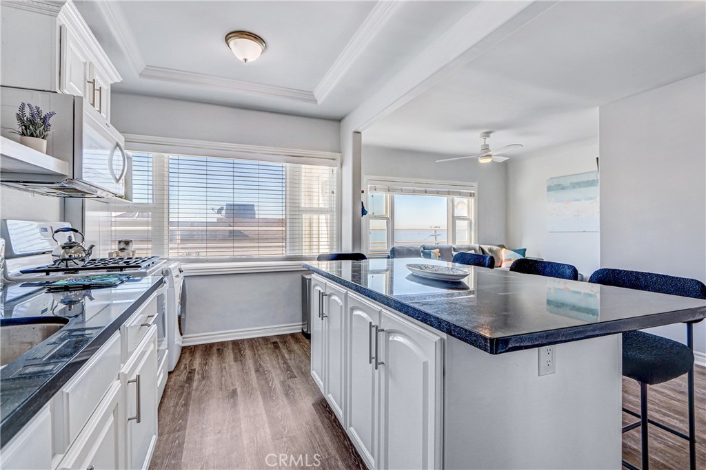 230 40th Street, Unit 1 Manhattan Beach, CA 90266 - Photo 8 of 19 a kitchen with stainless steel appliances granite countertop a sink stove and refrigerator