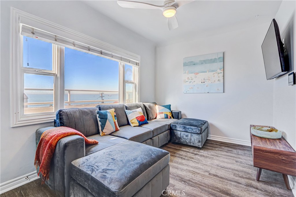 230 40th Street, Unit 1 Manhattan Beach, CA 90266 - Photo 9 of 19 a living room with furniture and a flat screen tv