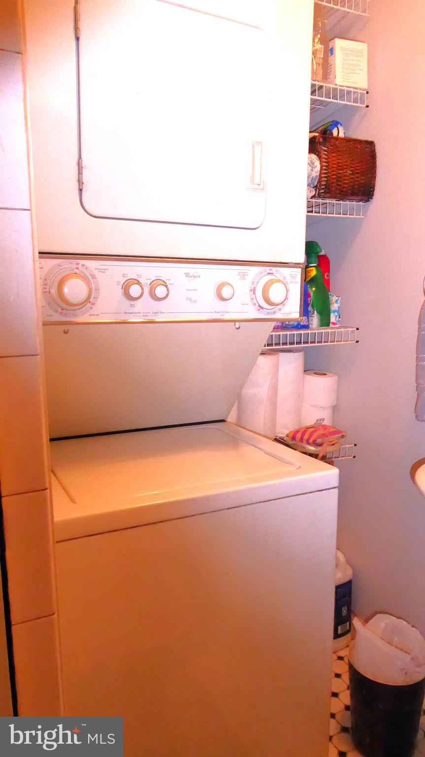 110 Daffodil Road Millville, NJ 08332 - Photo 15 of 37 a close up of a utility room with dryer and washer