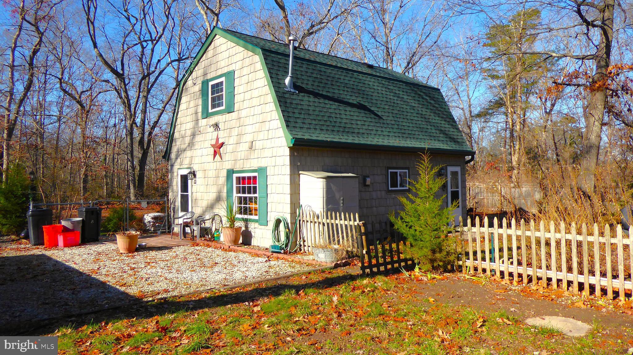 110 Daffodil Road Millville, NJ 08332 - Photo 29 of 37 a view of a house with a patio