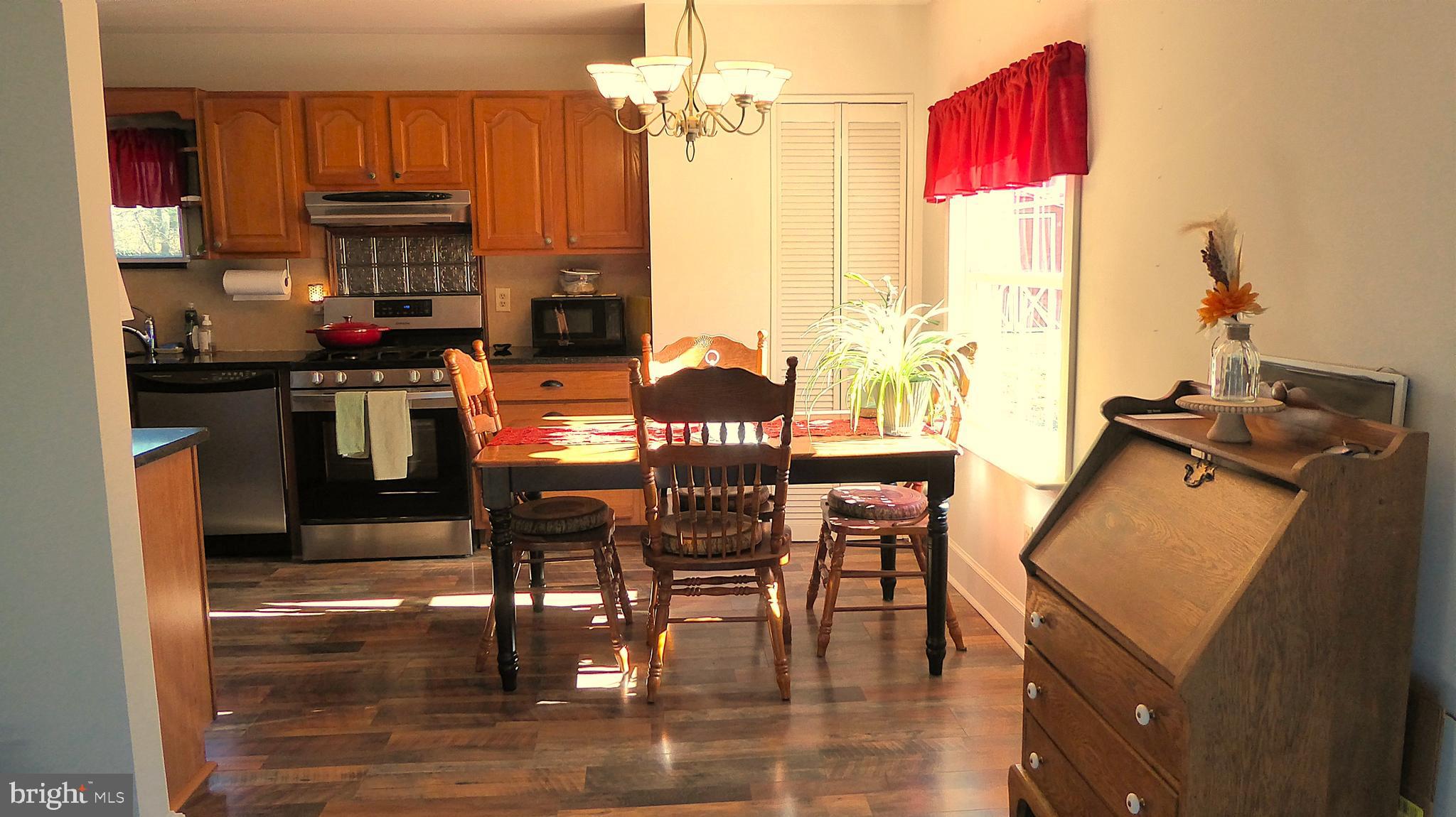 110 Daffodil Road Millville, NJ 08332 - Photo 8 of 37 a dining room with furniture window and wooden floor