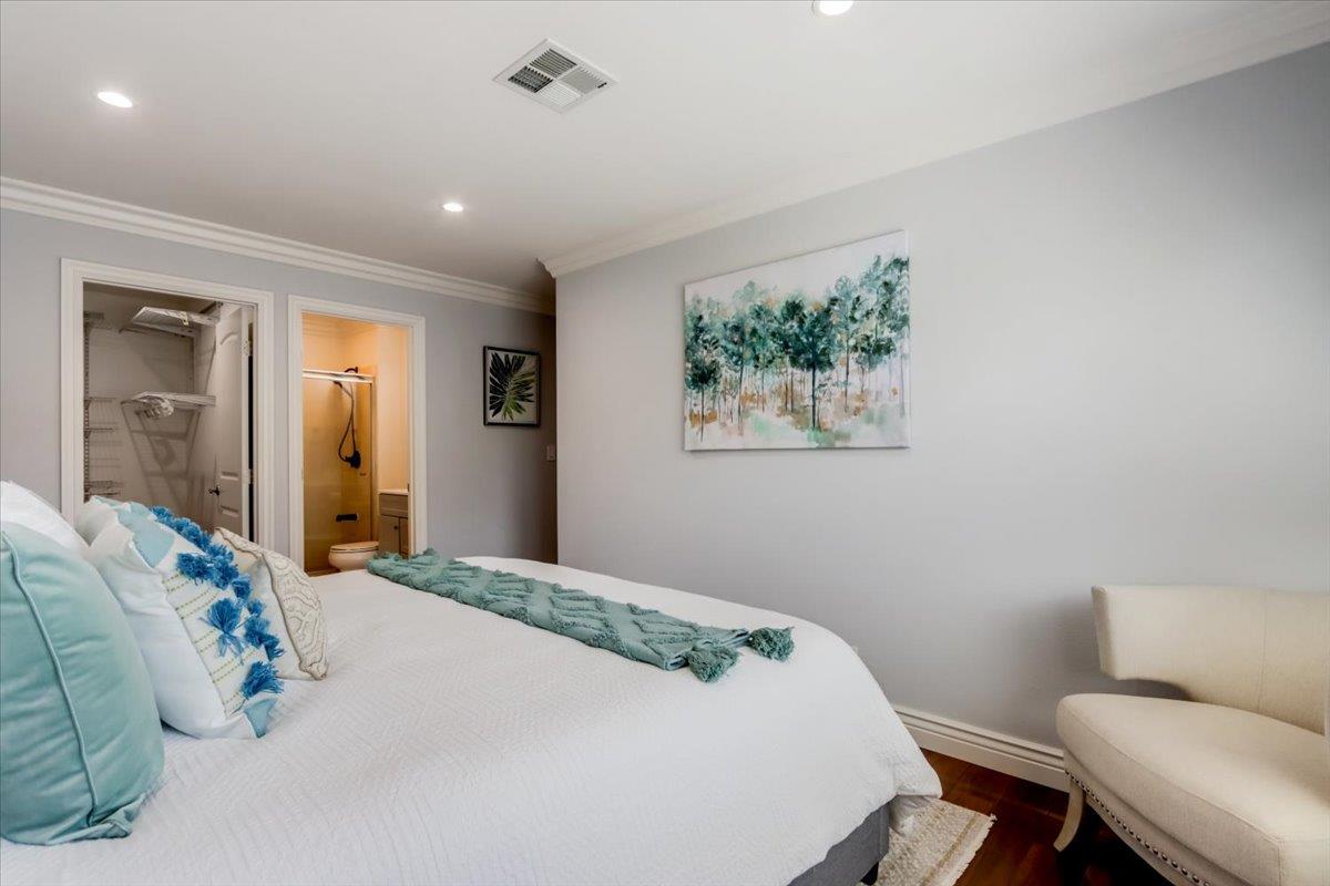 2284 Fallingtree Drive San Jose, CA 95131 - Photo 13 of 32 a bedroom with a bed and a chair