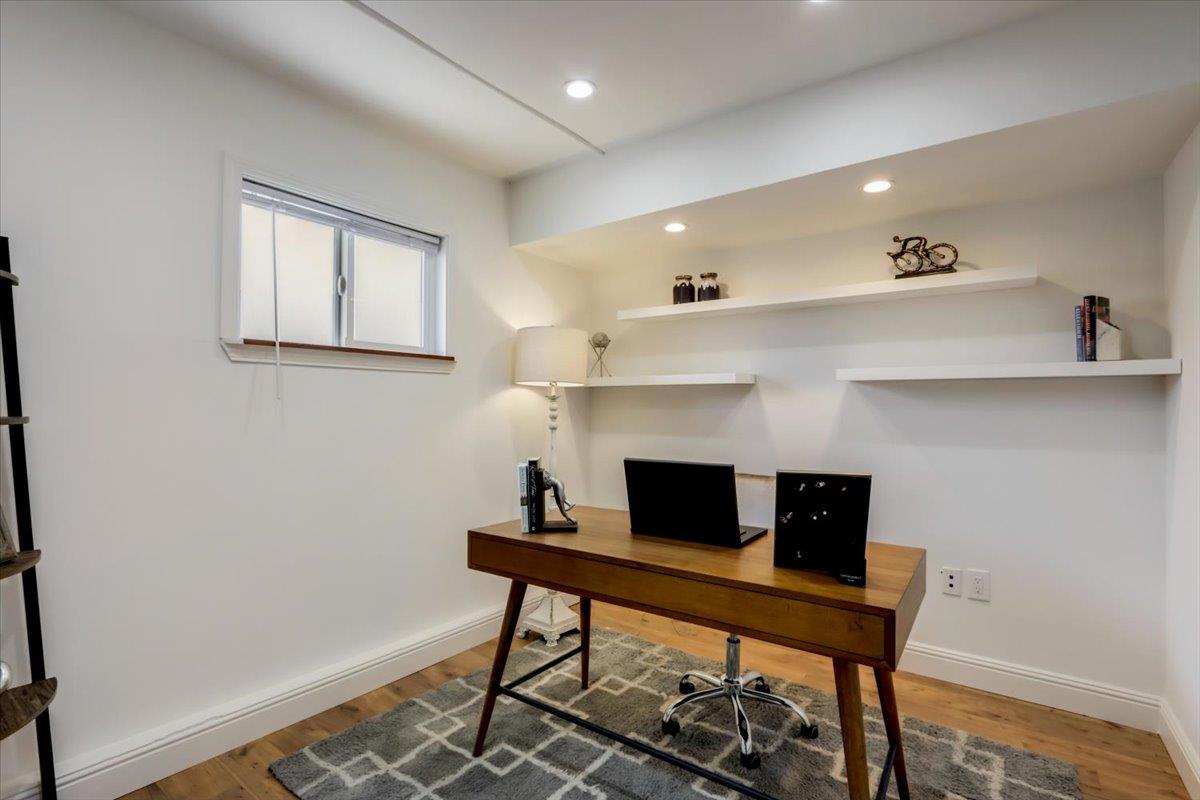 2284 Fallingtree Drive San Jose, CA 95131 - Photo 17 of 32 a view of a workspace with furniture and a fireplace