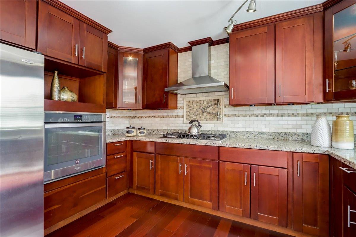 2284 Fallingtree Drive San Jose, CA 95131 - Photo 5 of 32 a kitchen with stainless steel appliances granite countertop a sink and cabinets
