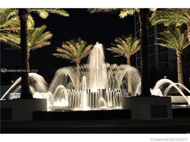 a view of swimming pool and dining table