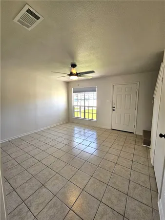 a view of an empty room and window