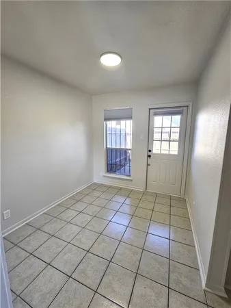 a view of an empty room and window