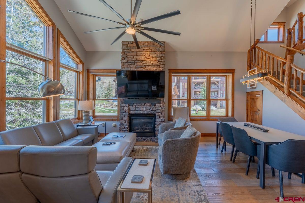 9 Hunter Hill Road, Unit 208 Crested Butte, CO 81225 - Photo 11 of 45 a living room with fireplace furniture and a flat screen tv