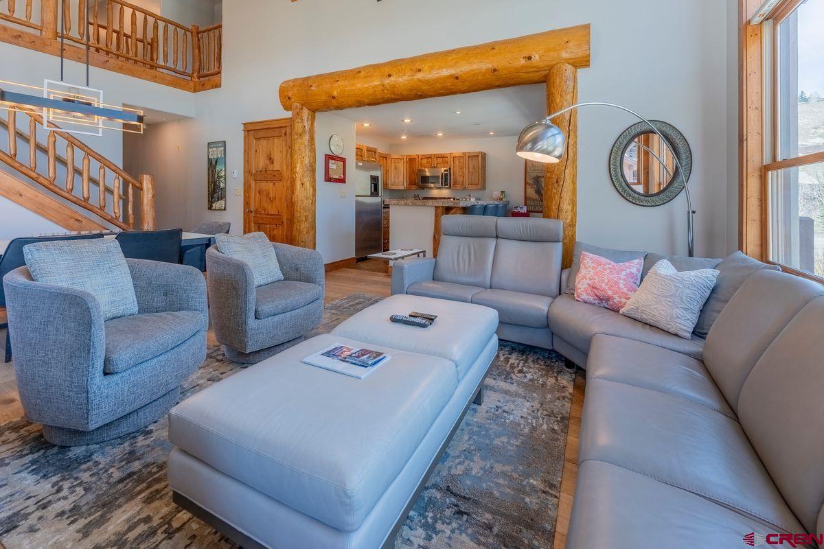 9 Hunter Hill Road, Unit 208 Crested Butte, CO 81225 - Photo 15 of 45 a living room with furniture and a clock