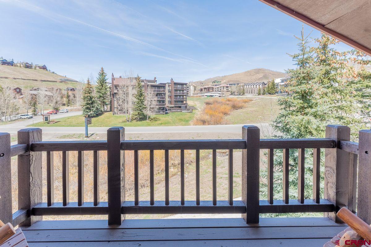 9 Hunter Hill Road, Unit 208 Crested Butte, CO 81225 - Photo 24 of 45 a city view from balcony with furniture