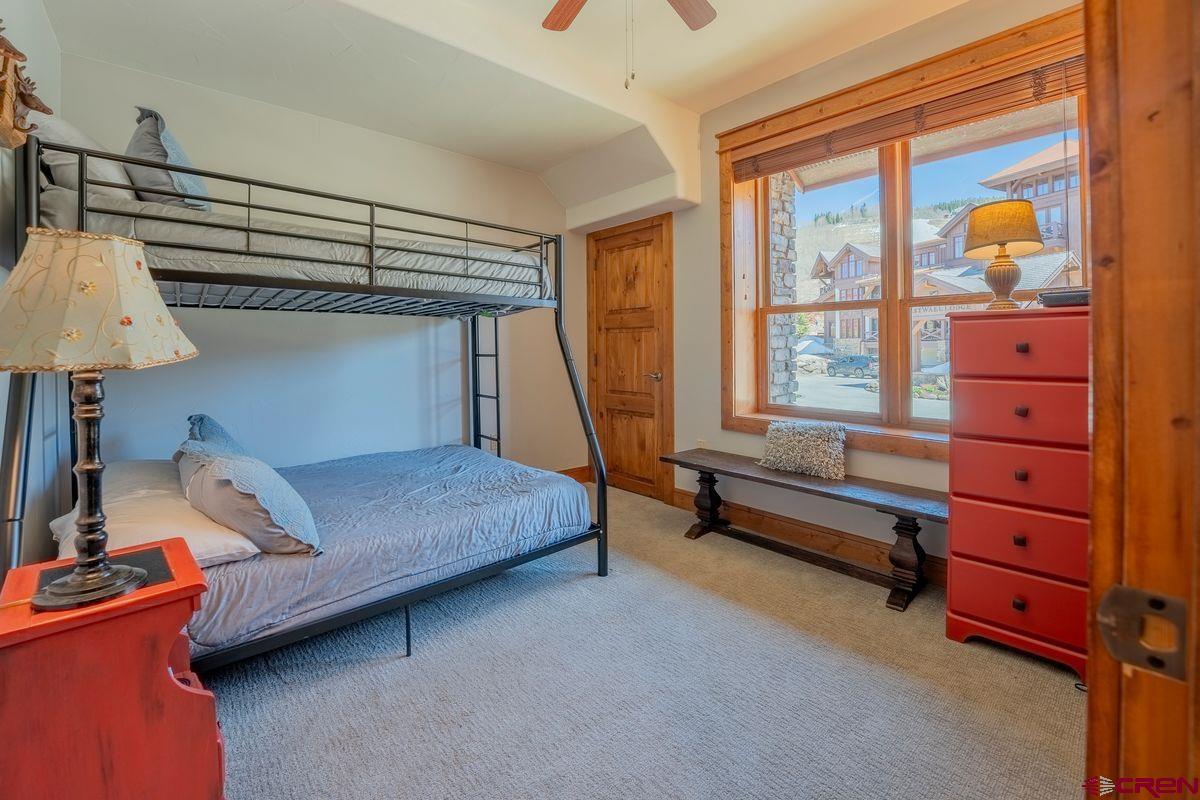9 Hunter Hill Road, Unit 208 Crested Butte, CO 81225 - Photo 28 of 45 a bedroom with a bed and a window