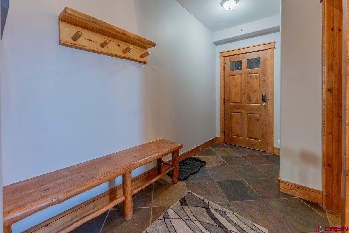 9 Hunter Hill Road, Unit 208 Crested Butte, CO 81225 - Photo 30 of 45 a view of a room with wooden floor