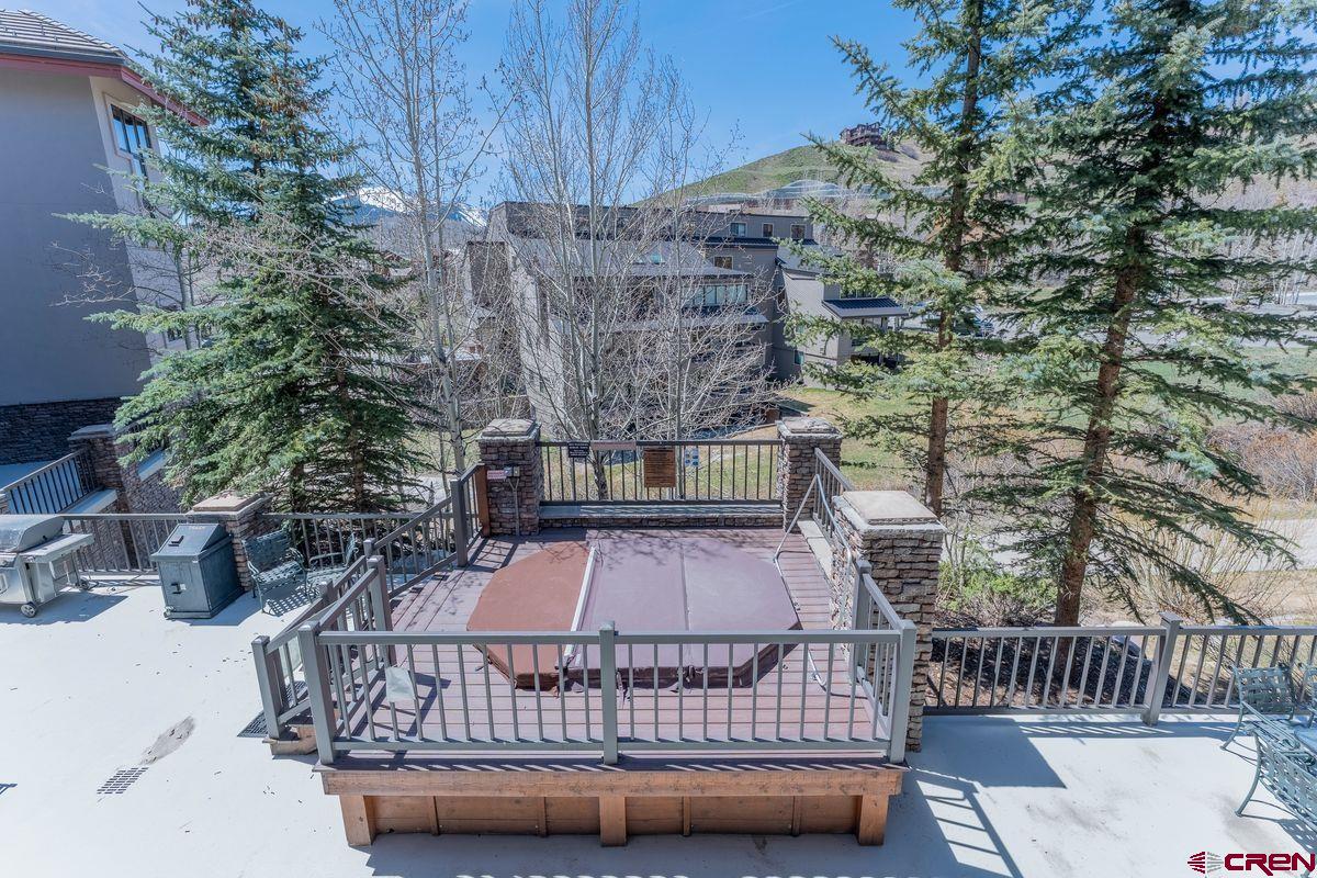 9 Hunter Hill Road, Unit 208 Crested Butte, CO 81225 - Photo 34 of 45 a view of balcony with wooden wall and seating