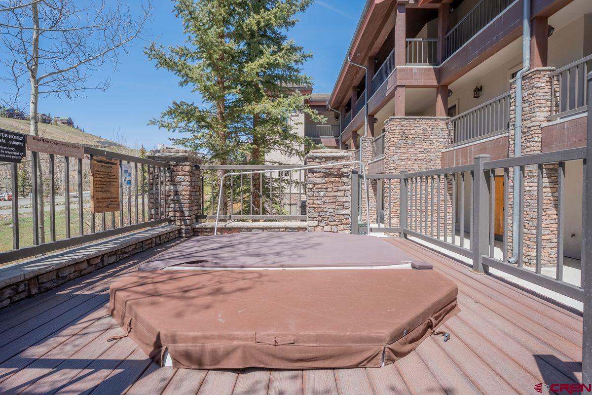 9 Hunter Hill Road, Unit 208 Crested Butte, CO 81225 - Photo 35 of 45 a view of a backyard with wooden floor