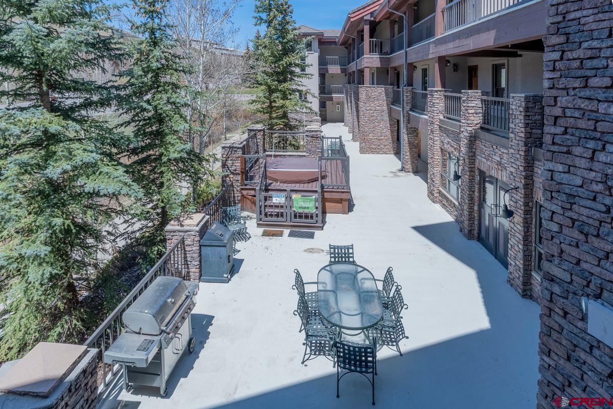 9 Hunter Hill Road, Unit 208 Crested Butte, CO 81225 - Photo 37 of 45 a view of multiple house with outdoor seating