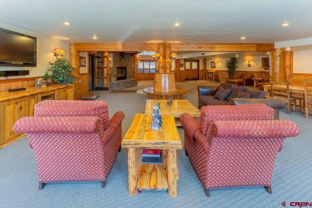 9 Hunter Hill Road, Unit 208 Crested Butte, CO 81225 - Photo 39 of 45 a living room with furniture and a flat screen tv