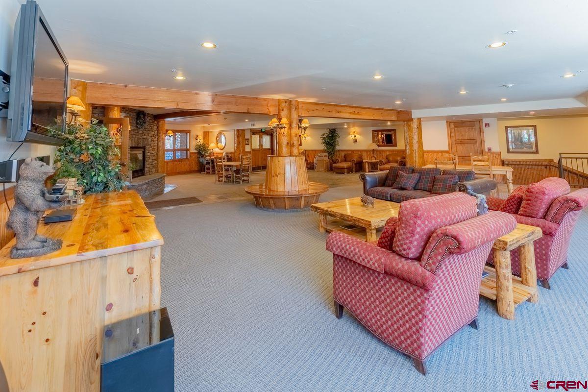9 Hunter Hill Road, Unit 208 Crested Butte, CO 81225 - Photo 40 of 45 a living room with furniture and a wooden floor