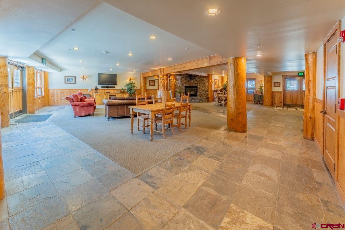 9 Hunter Hill Road, Unit 208 Crested Butte, CO 81225 - Photo 41 of 45 a living room with lots of furniture and kitchen view