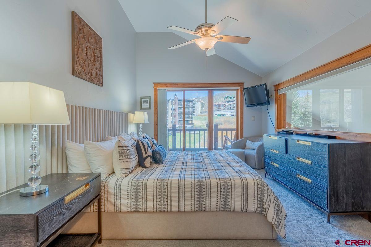 9 Hunter Hill Road, Unit 208 Crested Butte, CO 81225 - Photo 5 of 45 a bedroom with a large bed and a window