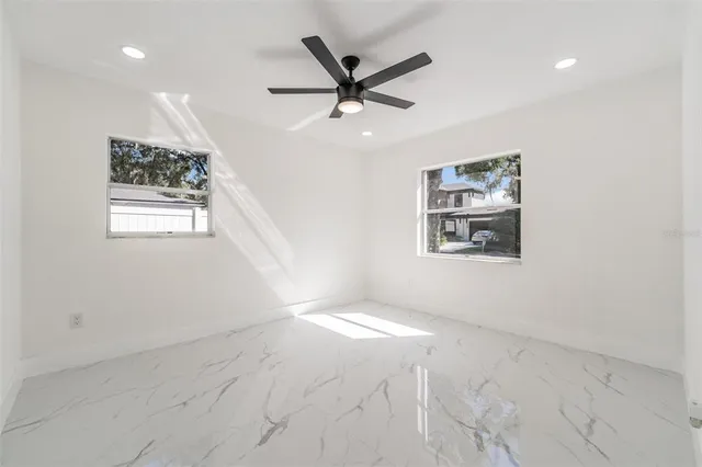 a bathroom with a toilet a sink and a mirror