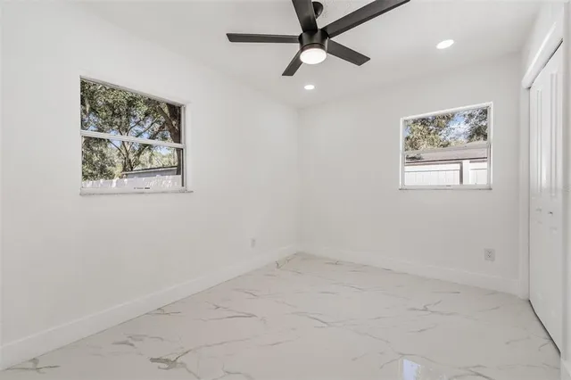 a view of a yard with a tree