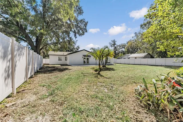 an aerial view of residential building and lake
