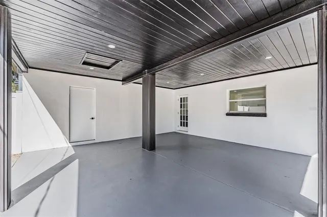 a bathroom with a sink mirror and shower
