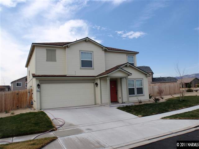 9020 Yeager Street Reno, NV 89506 - Photo 1 of 1 a front view of a house with garage and plants