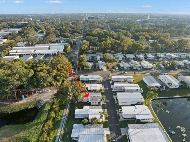 a living room with furniture ceiling fan and a window