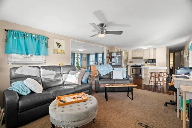 a kitchen with stainless steel appliances a refrigerator stove microwave and cabinets