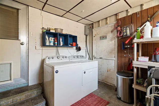 a patio with tables and chairs