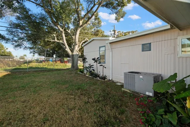a backyard of a house with lots of green space