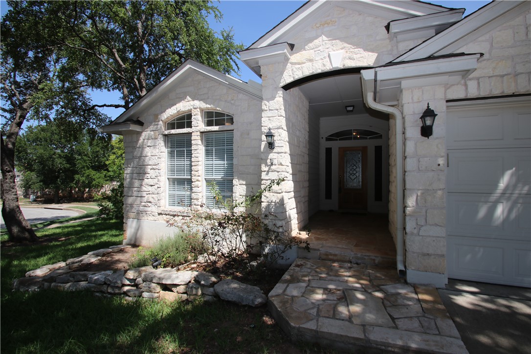 16516 Fowler Mill Cove Austin, TX 78717 - Photo 2 of 27 a front view of a house with a yard