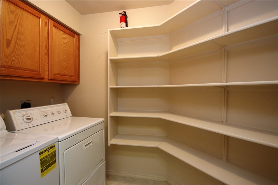 16516 Fowler Mill Cove Austin, TX 78717 - Photo 23 of 27 a storage room with washer and dryer