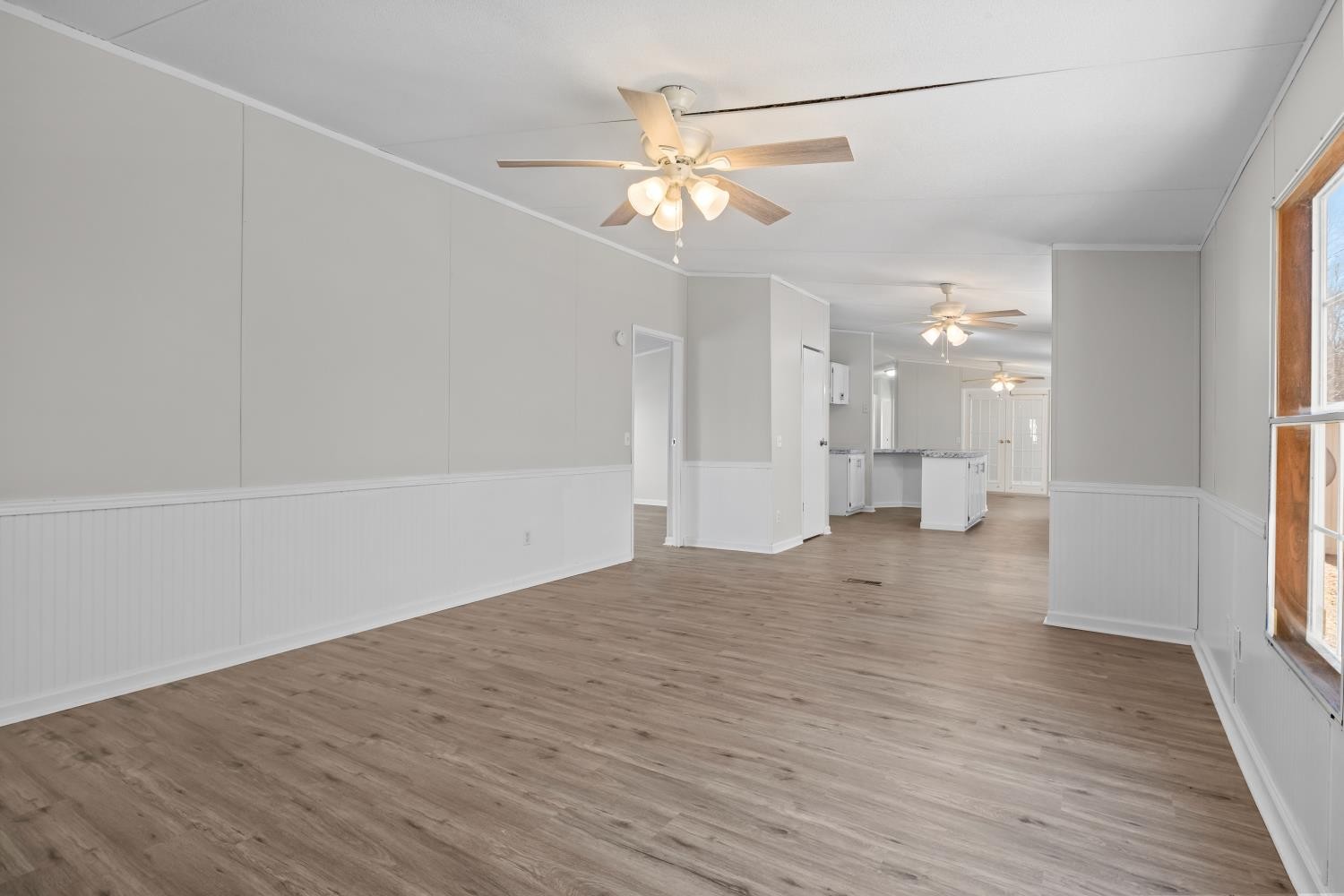 624 Nickletown Road Sugar Tree, TN 38380 - Photo 21 of 45 a view of an empty room with wooden floor and a window