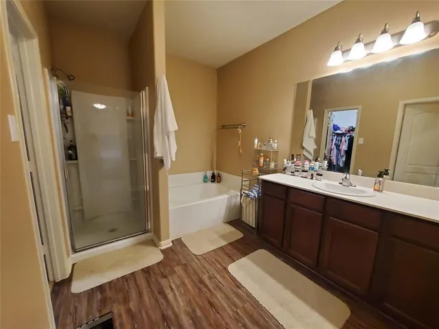 a bathroom with a double vanity sink mirror double and shower