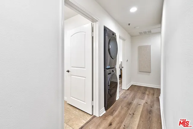 a view of hallway with wooden floor