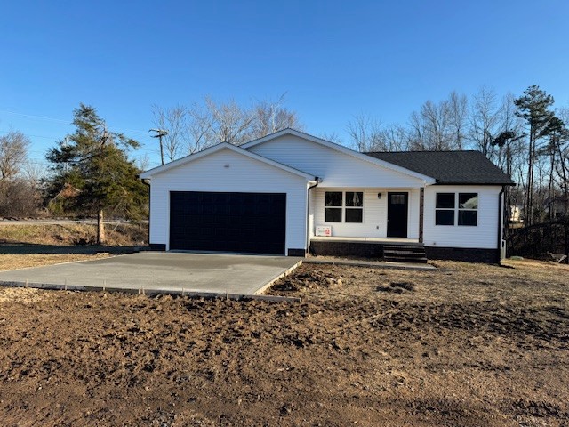 103 Irene Lane Hohenwald, TN 38462 - Photo 1 of 21 a front view of a house with a garden