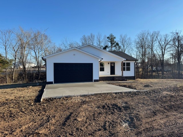 103 Irene Lane Hohenwald, TN 38462 - Photo 4 of 21 a front view of a house with a yard