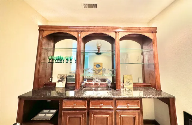 a close view of dining table chairs and window