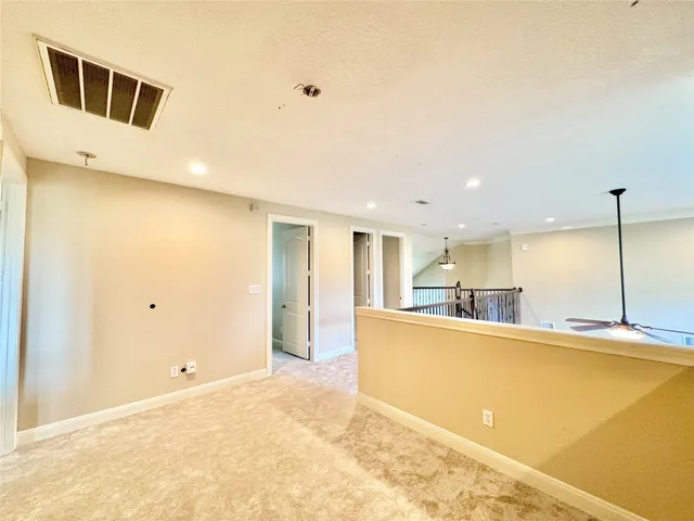 a large kitchen with stainless steel appliances a refrigerator and a stove top oven