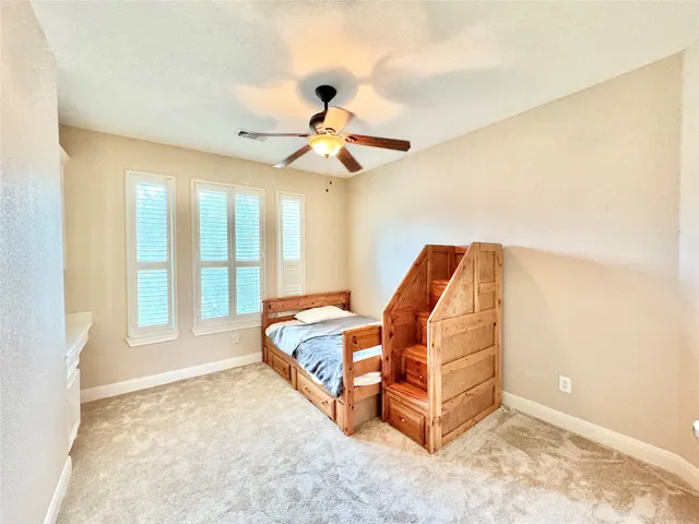 a bed room with a bed and a window