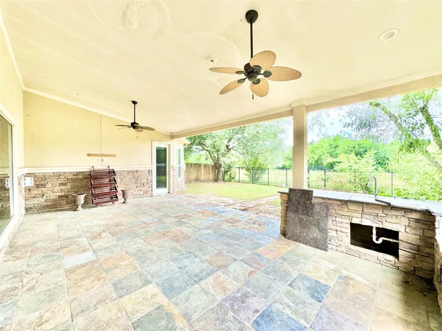 a view of a living room and a floor to ceiling window