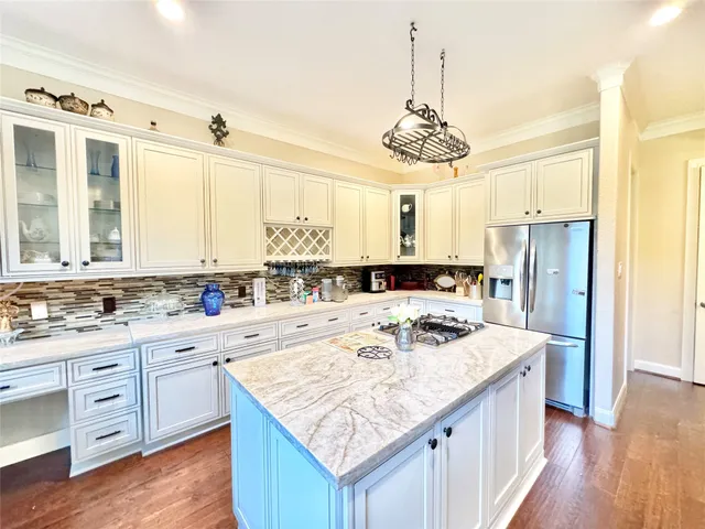 a kitchen with a sink stove and refrigerator