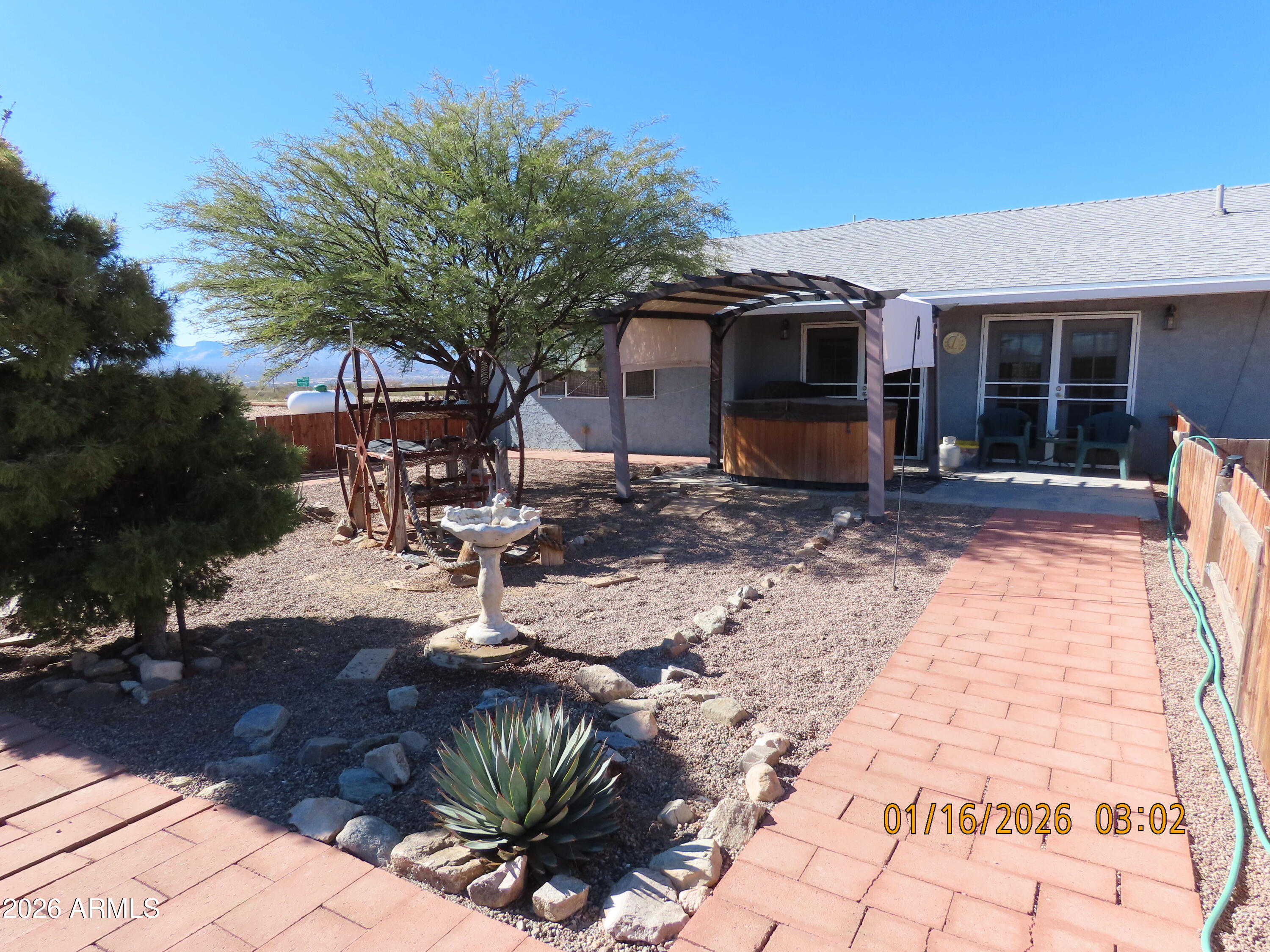 311 North Saddle Vista Road Benson, AZ 85602 - Photo 11 of 36 a view of a house with backyard