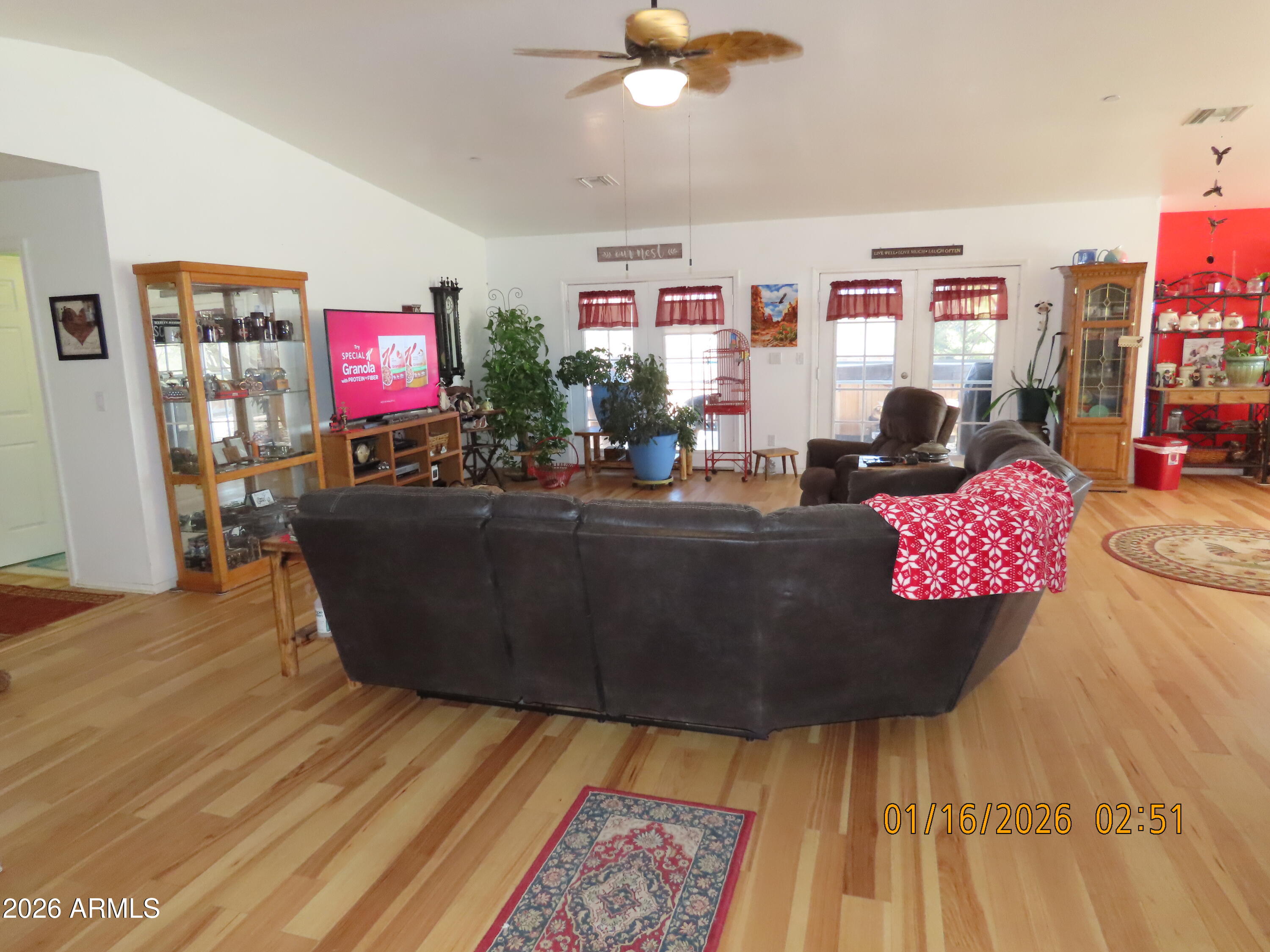 311 North Saddle Vista Road Benson, AZ 85602 - Photo 13 of 36 a living room with furniture and a flat screen tv
