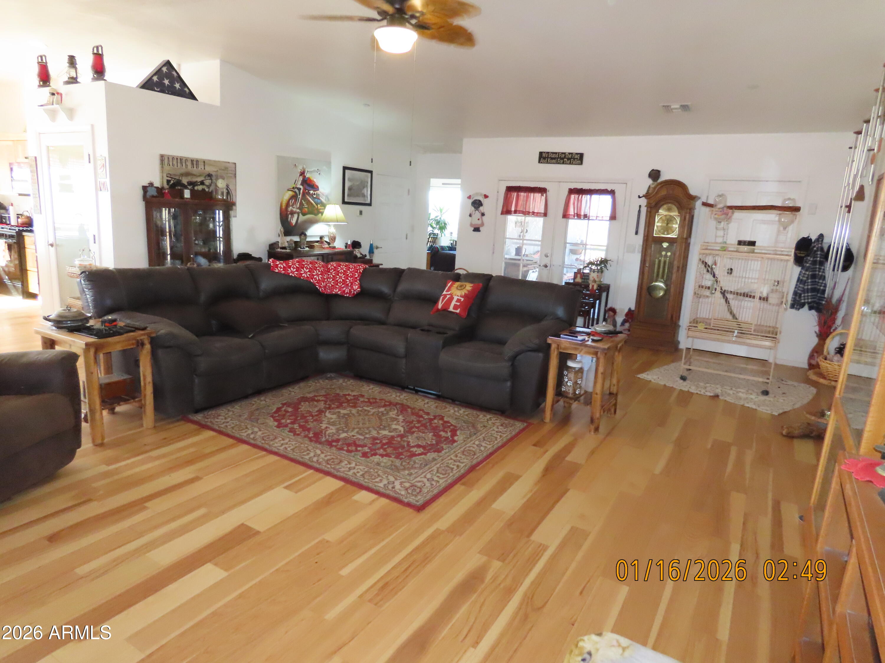 311 North Saddle Vista Road Benson, AZ 85602 - Photo 16 of 36 a living room with furniture and wooden floor