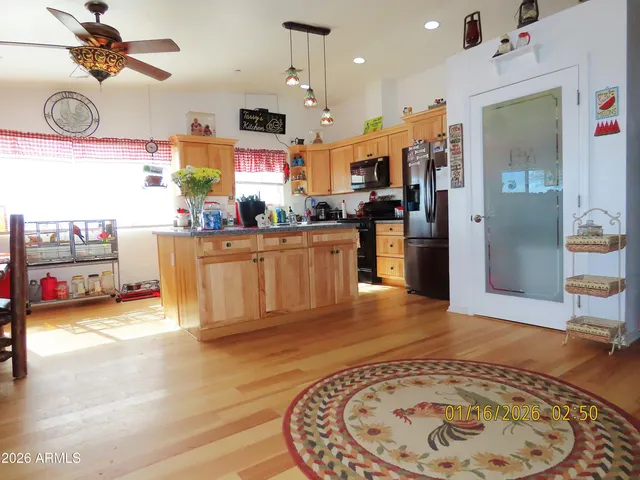 a view of a kitchen and dining room
